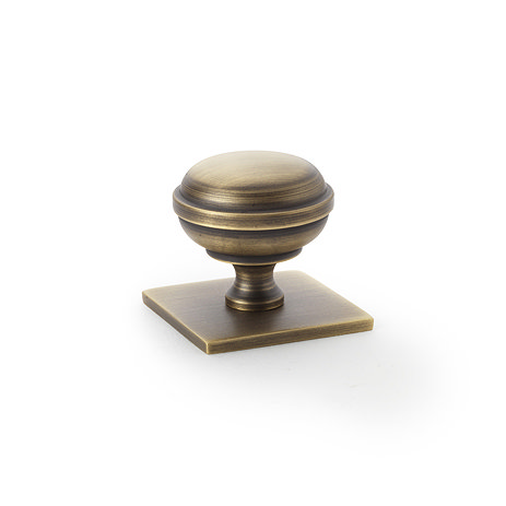 Isen Antique Brass Cupboard Knob on Square Plate Image