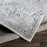 image of vintage grey-blue rug folded over to show material underneath