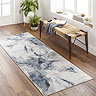 image of grey-blue abstract runner on wooden flooring
