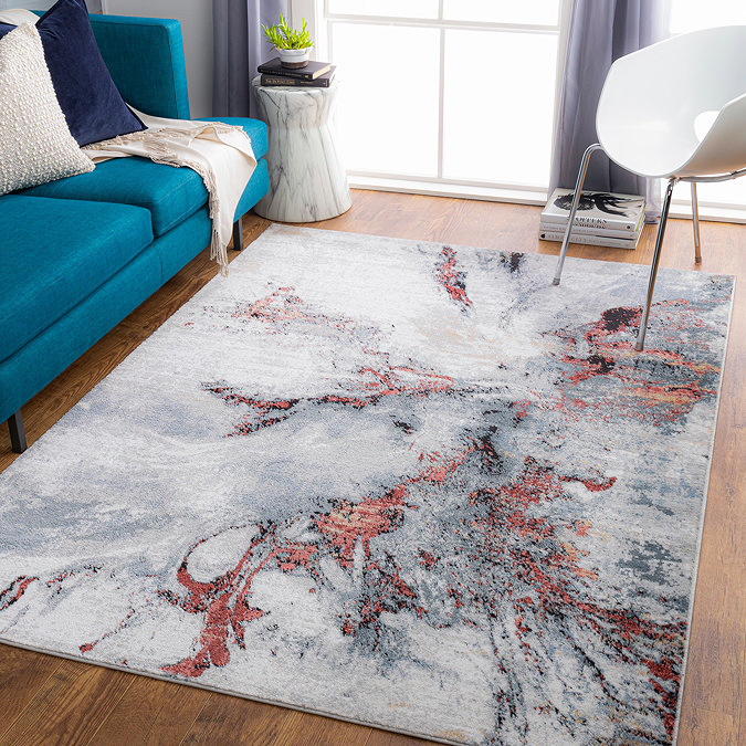 image of grey and burgundy marbled area rug on wooden floor of living room