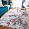 image of grey and burgundy marbled area rug on wooden floor of living room
