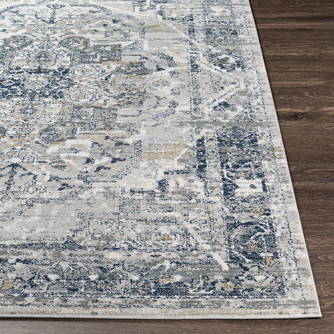 close up image of vintage blue rug laid flat to suggest thickness