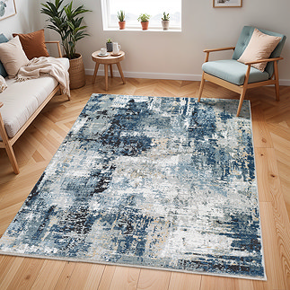 image of modern abstract area rug in shades of blue, grey and beige, on light wooden flooring of apartment