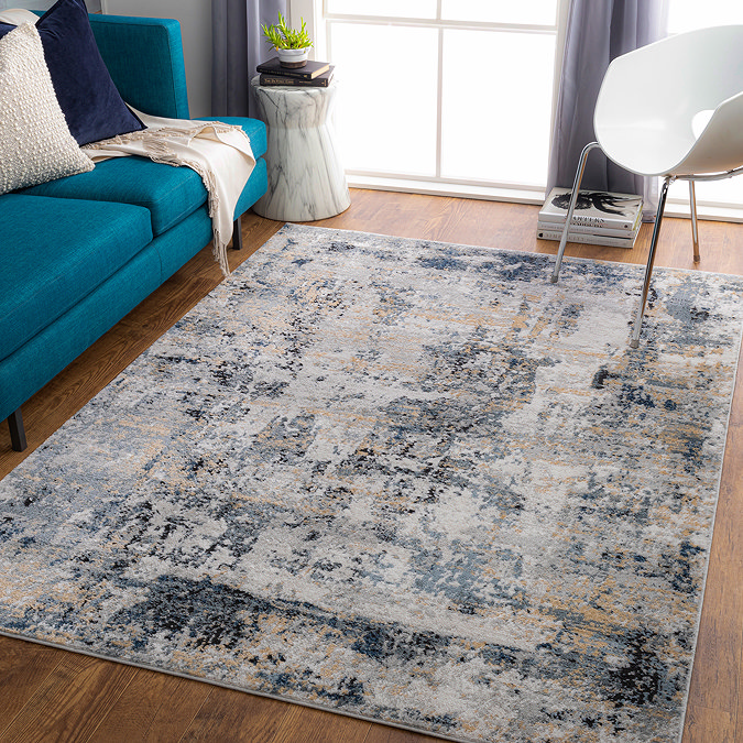 image of grey marbled abstract rug on wooden flooring of modern apartment