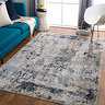 image of grey marbled abstract rug on wooden flooring of modern apartment