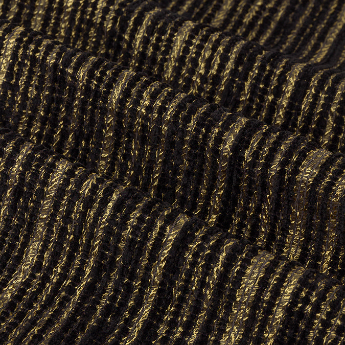 Jupiter Eyelet curtains in black and gold close up texture image