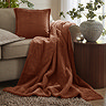 Kallu Throw Rust cushion and throw shot