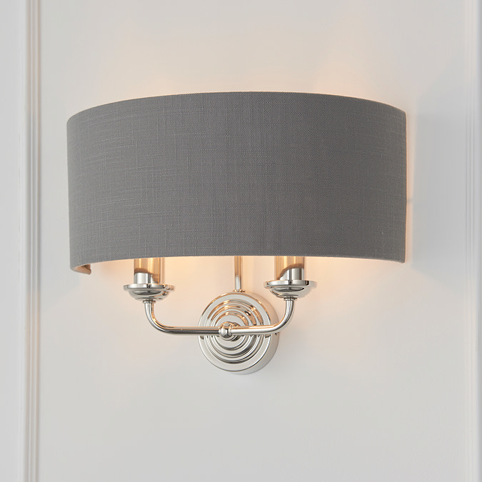closer image of charcoal shade and 2 nickel coloured arms of wall lamp