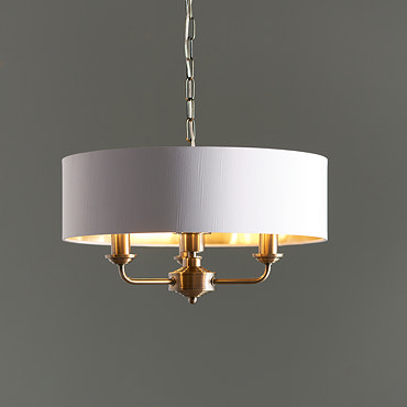 wide shot of the kensington lighting range in antique brass