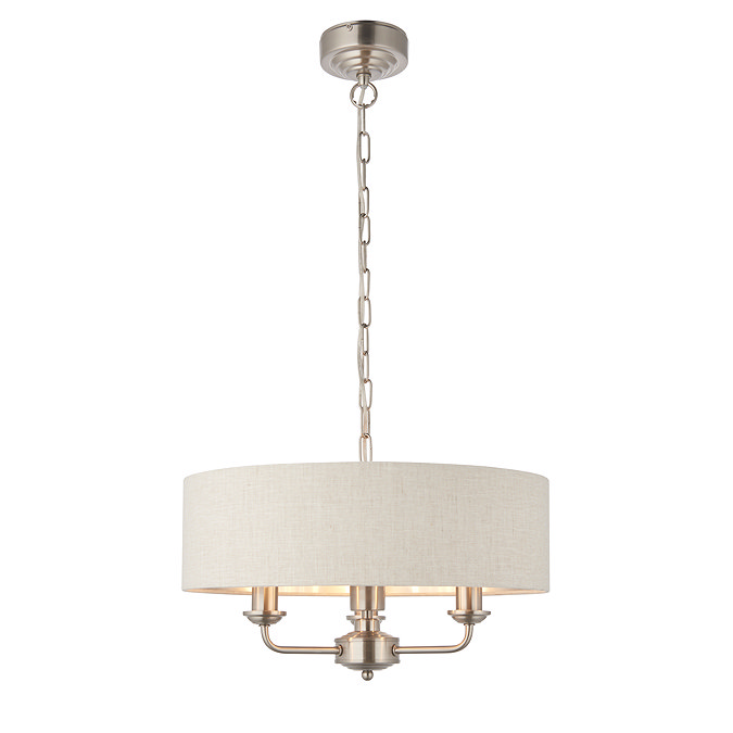 image cut out on white background of pendant beige lampshade with chrome fixture