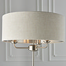 close up on natural shade of three arm chrome floor lamp