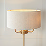 close up on natural linen shade of vintage table lamp with vintage brass body