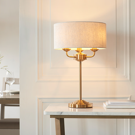 image of vintage brass table lamp with natural linen fabric shade