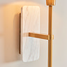 close up on white marble backplate of wall light