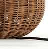 close up image of base of rattan lamp with black wire