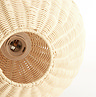 close up on circular top of rounded rattan lamp, showing where bulb will sit within