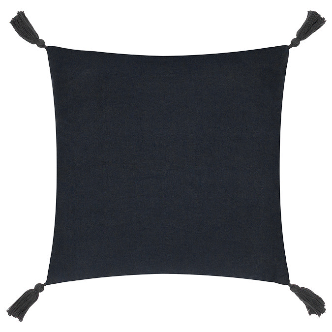 image cut out on white background of back of black square cushion with tasselled corners