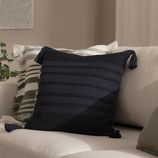 image of square black cushion with subtle textured stripes and tasselled edges