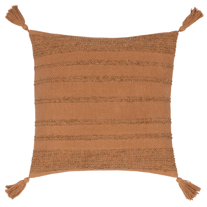 image cut out on white background of dark orange cushion with tasselled corners