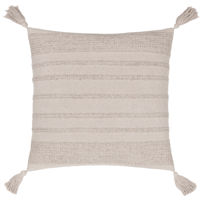 image cut out on white background of stone coloured tufted stripe front cushion with four tasselled corners