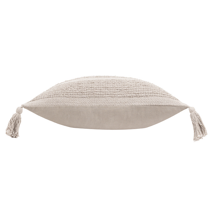 image cut out on white background of stone coloured tufted cushion on its side to show its plushness