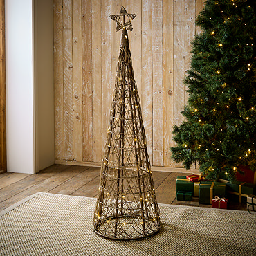 wicker christmas tree with star on the top, cut out on white background