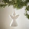 large white wood angel decoration, hanging from a christmas tree