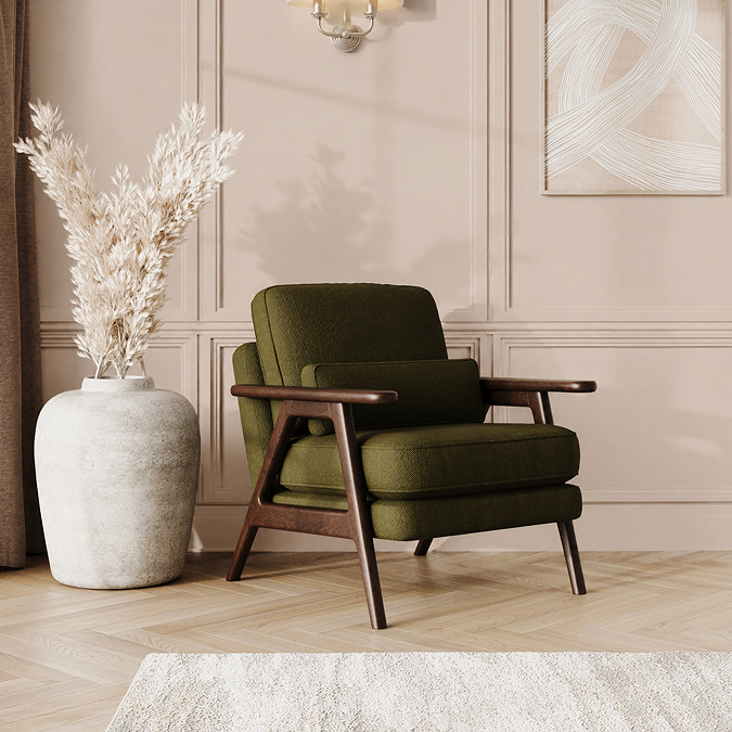 lifestyle image of mid-century accent chair with forest green chenille-velvet fabric and warm wood frame