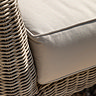 close up on plush cream cushions of outdoor sofa