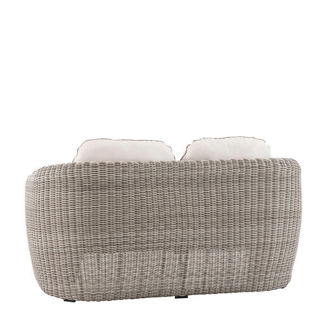 back image cut out on white background of rattan two seat sofa with rattan sides and plush cream cushions