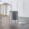 image of velvet grey with gold legs, stool on dark wooden floor