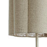 close up on lower half of cylindrical natural coloured lamp shade with petal-shaped edge