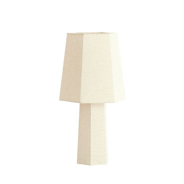 image cut out on white background of cream lamp with geometric shade and bulb inside emitting warm glow