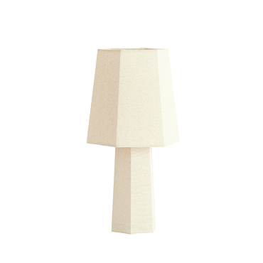 image cut out on white background of cream lamp with geometric shade and bulb inside emitting warm glow