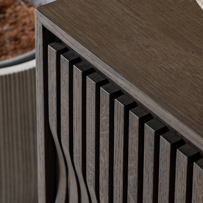 close up image of wave panel style of sideboard doors