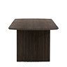 side on cut out of walnut dining table with ribbed legs