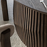 close up image of wavy slatted legs of walnut oval dining table