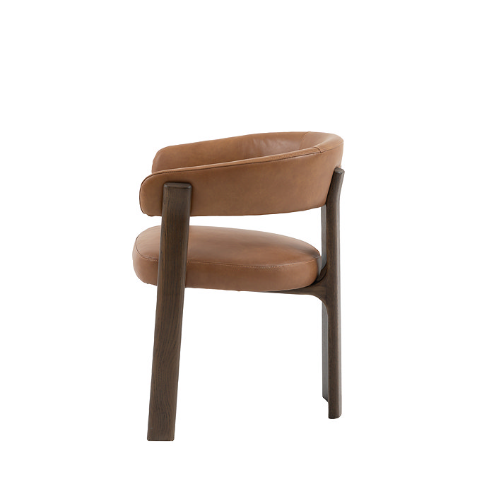 side on cut out of brown leather dining chair with rounded back
