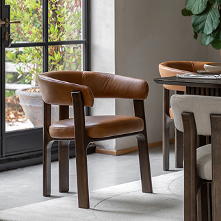 image of brown leather dining chair with rounded back and ash wood legs