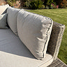 close up image of plush cushions and rattan backing of outdoor corner set