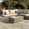 image of rattan five seat corner sofa set with matching rectangular table on flagstones of patio