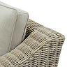 close up image of gentle slope of arm of beige rattan garden armchair