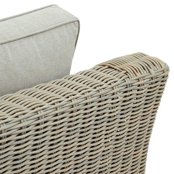 close up image on beige rattan back of garden armchair