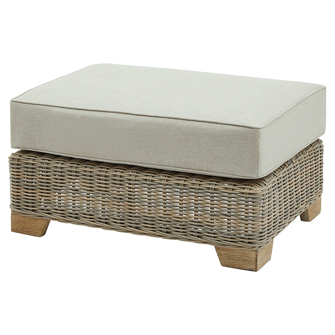 image cut out on white background of rattan footstool with plush top cushion