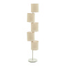 image cut out on white background of multi shade natural coloured floor lamp with circular base