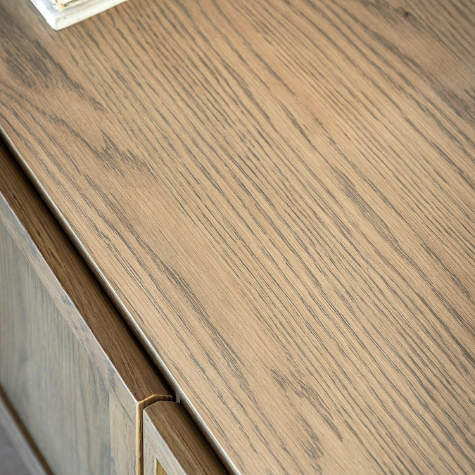 close up on wood texture of smoked oak panelled media unit