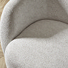 close up image on cream chenille fabric of swivel chair