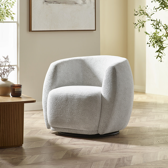 image of dark cream-grey rounded chair in chenille fabric on light wood floor