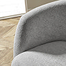 close up on arm of grey chenille swivel accent chair