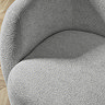 close up on grey chenille upholstered swivel chair